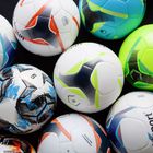 Piłka do piłki nożnej uhlsport Resist Synergy biała/czarna/neonowa pomarańczowa rozmiar 5